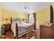 Comfortable bedroom with hardwood floors, ceiling fan, side tables with lamps, and dresser at 3105 Carrollton Ct, The Villages, FL 32162