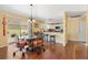 The dining area features a glass-top table, wrought iron chairs, and is located off the kitchen at 3105 Carrollton Ct, The Villages, FL 32162