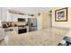 Bright kitchen with granite countertops, stainless steel appliances, and white cabinetry for a clean look at 3105 Carrollton Ct, The Villages, FL 32162
