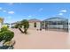 Enclosed patio featuring a concrete pool and palm trees adds an inviting outdoor space at 3105 Carrollton Ct, The Villages, FL 32162