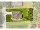 Aerial view of new home on large lot with mature trees and well manicured lawn at 321 Watershore Dr, Leesburg, FL 34748