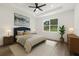 Comfortable bedroom featuring a plush bed, natural light, and contemporary decor at 321 Watershore Dr, Leesburg, FL 34748