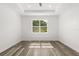 Bright bedroom with a large window offering serene views at 321 Watershore Dr, Leesburg, FL 34748