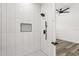 Walk-in shower with black fixtures at 321 Watershore Dr, Leesburg, FL 34748