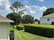 View of the backyard highlighting lush greenery and privacy landscaping at 3416 Capland Ave, Clermont, FL 34711