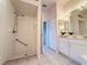 Bathroom showcasing tiled walk-in shower, neutral tile floor and spacious vanity at 3416 Capland Ave, Clermont, FL 34711