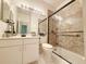 Bathroom showcasing a vanity with countertop and a glass enclosed walk-in shower at 3416 Capland Ave, Clermont, FL 34711