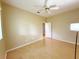 Bedroom featuring laminate flooring, ceiling fan and closet at 3416 Capland Ave, Clermont, FL 34711