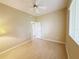Bright bedroom with laminate flooring, ceiling fan, and natural light at 3416 Capland Ave, Clermont, FL 34711
