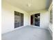 Spacious lanai featuring neutral colors and access to the home's interior at 3416 Capland Ave, Clermont, FL 34711