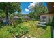 The backyard features a garden, a playset, and a dining table at 35338 Lake Unity Rd, Fruitland Park, FL 34731