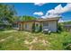 View of the backyard, showing a small table with an umbrella at 35338 Lake Unity Rd, Fruitland Park, FL 34731