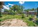 Large backyard area with garden beds and lush landscaping at 35338 Lake Unity Rd, Fruitland Park, FL 34731