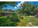 Well-maintained backyard with garden beds and a play area at 35338 Lake Unity Rd, Fruitland Park, FL 34731