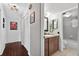 Bathroom featuring a single vanity with granite countertop and shower with a tile surround at 35338 Lake Unity Rd, Fruitland Park, FL 34731