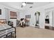 Bedroom with carpeted floor, a ceiling fan, and desk area with natural light at 35338 Lake Unity Rd, Fruitland Park, FL 34731
