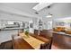 Open dining room with skylight and adjacent kitchen and living room at 35338 Lake Unity Rd, Fruitland Park, FL 34731