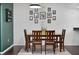 Cozy dining area with decorative wall art and seating for four at 35338 Lake Unity Rd, Fruitland Park, FL 34731