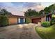Charming single-story brick home featuring a two-car garage and well-manicured landscaping at 35338 Lake Unity Rd, Fruitland Park, FL 34731