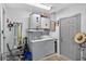 Practical laundry room with washer, dryer, and utility storage at 35338 Lake Unity Rd, Fruitland Park, FL 34731