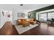 Inviting living room with stylish décor, hardwood floors, and a comfortable leather sectional at 35338 Lake Unity Rd, Fruitland Park, FL 34731