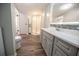 Updated bathroom with a glass shower, modern vanity, and wood-look flooring at 36812 Skycrest Blvd, Fruitland Park, FL 34731