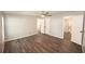 Spacious bedroom with wood-look flooring, neutral paint, and ample closet space at 36812 Skycrest Blvd, Fruitland Park, FL 34731
