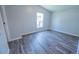 A bedroom with neutral walls and updated wood-look flooring at 36812 Skycrest Blvd, Fruitland Park, FL 34731