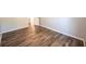 A bedroom featuring neutral walls and stylish wood flooring at 36812 Skycrest Blvd, Fruitland Park, FL 34731