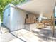 Home exterior featuring a carport and deck at 36812 Skycrest Blvd, Fruitland Park, FL 34731