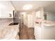 Modern kitchen featuring stainless steel appliances, white cabinets, and stylish countertops at 36812 Skycrest Blvd, Fruitland Park, FL 34731