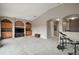 Open-concept bonus room with carpeted floors and ample room for activities at 36914 Bee Meadow Ct, Eustis, FL 32736