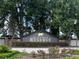Elegant entrance to Black Bear Reserve with lush landscaping and decorative signage at 36914 Bee Meadow Ct, Eustis, FL 32736