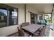 Spacious covered patio with dining table and chairs, perfect for outdoor entertaining and relaxation at 36914 Bee Meadow Ct, Eustis, FL 32736