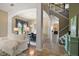Grand foyer showcasing elegant tile flooring, a staircase, and an open-concept layout at 36914 Bee Meadow Ct, Eustis, FL 32736