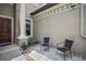 Charming front porch with comfortable seating area and elegant architectural details at 36914 Bee Meadow Ct, Eustis, FL 32736