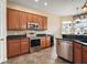 Modern kitchen featuring stainless steel appliances, dark countertops, and ample cabinet space, ideal for cooking enthusiasts at 36914 Bee Meadow Ct, Eustis, FL 32736