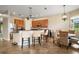 Well-equipped kitchen with bar seating and a cozy breakfast nook, perfect for casual dining and entertaining at 36914 Bee Meadow Ct, Eustis, FL 32736