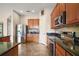 Beautiful kitchen featuring stainless steel appliances, ample cabinetry, and seamlessly flowing into the adjacent living area at 36914 Bee Meadow Ct, Eustis, FL 32736