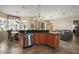 Inviting kitchen showcasing granite countertops, stainless appliances, and open layout to the living space at 36914 Bee Meadow Ct, Eustis, FL 32736