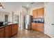 Bright kitchen area with stainless steel refrigerator, cabinetry, and counter space, perfect for cooking and storage at 36914 Bee Meadow Ct, Eustis, FL 32736