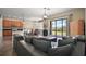 Spacious living area with sliding glass doors leading to backyard and seamlessly connecting to open kitchen at 36914 Bee Meadow Ct, Eustis, FL 32736