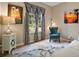 Comfortable living room with patterned drapes, stylish furniture, and art at 36914 Bee Meadow Ct, Eustis, FL 32736