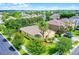 Traditional style single Gathering home featuring well-maintained landscaping and an attached garage with a double driveway at 418 Rock Springs Cir, Groveland, FL 34736