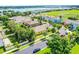 Single-Gathering home in a desirable neighborhood with mature trees and lush landscaping near a lake and green space at 418 Rock Springs Cir, Groveland, FL 34736