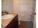 Standard bathroom featuring a sink with laminate countertops, and a toilet with linoleum flooring at 5016 Mcdonald Rd, Zellwood, FL 32798