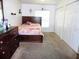 Bedroom with carpet flooring and built-in closet at 5016 Mcdonald Rd, Zellwood, FL 32798