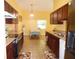 Eat-in kitchen with tile floors and stainless steel appliances at 5016 Mcdonald Rd, Zellwood, FL 32798
