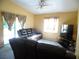 Comfortable living room with a ceiling fan and carpet flooring at 5016 Mcdonald Rd, Zellwood, FL 32798