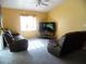 Bright living room with carpet and a ceiling fan at 5016 Mcdonald Rd, Zellwood, FL 32798